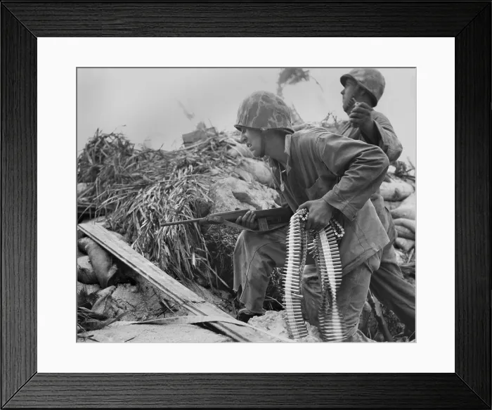 Framed Print : On Tarawa, a U.S. Marine, with a carbine and a bandolier of bullets. He waits for his buddy to toss a hand grenade, before he advances toward Japanese. Nov