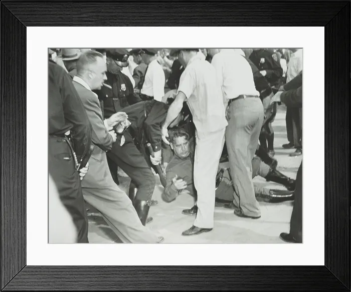 Framed Print : State trooper on the ground after he was hit by a rioter's rock during the Paul Robeson concert. Peekskill, N.Y. Sept. 4, 1949