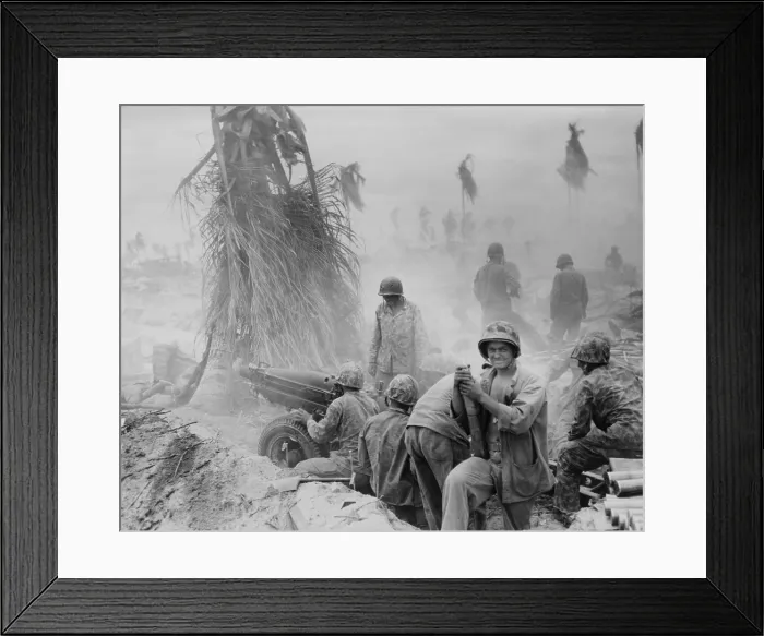 Framed Print : U.S. Marine artillery crew during the Battle of Tarawa. Standing beside the howitzer is a Marine with two bullet holes in his helmet. Nov. 20-23, 1943