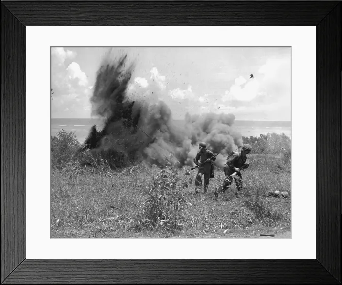 Framed Print : U.S. Marines just after throwing a TNT charge into a Japanese dugout in Saipan Framed Print : U.S. Marines just after throwing a TNT charge into a Japanese dugout in Saipan