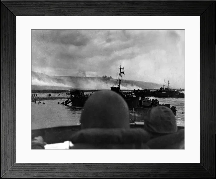Framed Print : Silhouetted by helmets, view shows two landing craft at Omaha beach on D-Day. Each large ship landed 200 soldiers. June 6, 1944, World War 2. (BSLOC_2014_2_25)