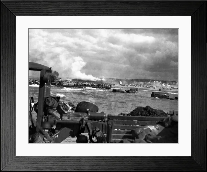 Framed Print : U.S. landing craft approaching Omaha Beach in Normandy beach on Dec. 6, 1944. Soldiers are standing on ships decks, indicating heavy German resistance had ceased Framed Print : U.S. landing craft approaching Omaha Beach in Normandy beach on Dec. 6, 1944. Soldiers are standing on ships decks, indicating heavy German resistance had ceased