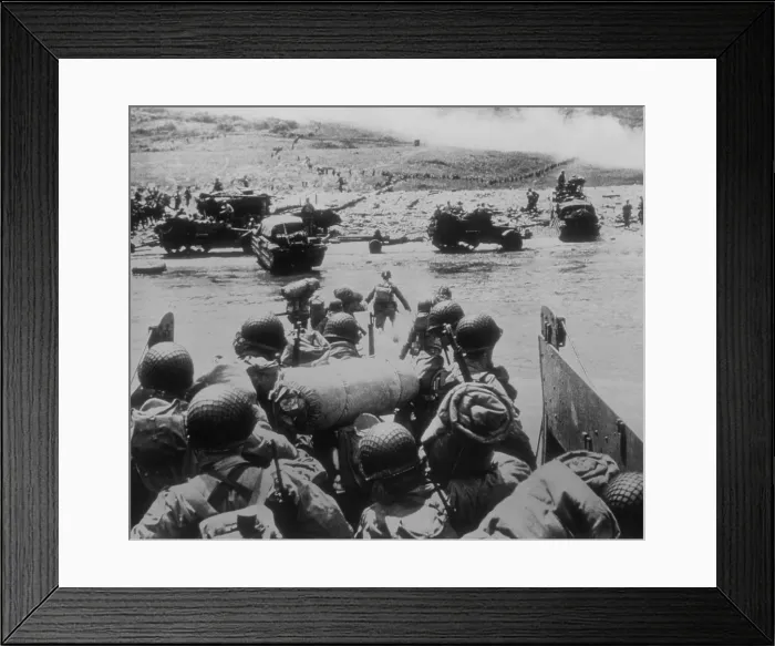 Framed Print : U.S. soldiers landing on Utah Beach, the westernmost landing of the D-Day invasions. In the distance soldiers move inland, as more men and supplies come ashore Framed Print : U.S. soldiers landing on Utah Beach, the westernmost landing of the D-Day invasions. In the distance soldiers move inland, as more men and supplies come ashore