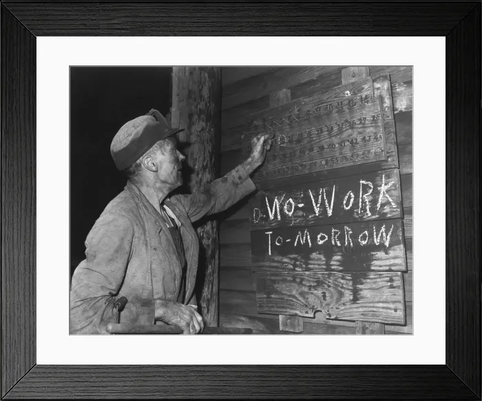 Framed Print : A coal loader putting up his check at the end of day's work on Friday, Sept. 13, 1946