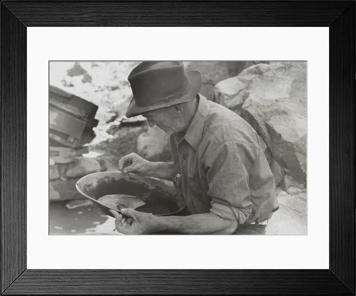 Framed Print : Man panning gold at Pinos Altos, New Mexico. He holds a gold nugget. May-June, 1940. Photo by Russell Lee. (BSLOC_2014_13_236)