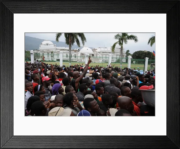 Framed Print : Haitians gathers for food distribution in front of the destroyed Presidential Palace in Port au Prince Haiti on Jan. 25 2010. A 7.0-magnitude earthquake on January 12 2010