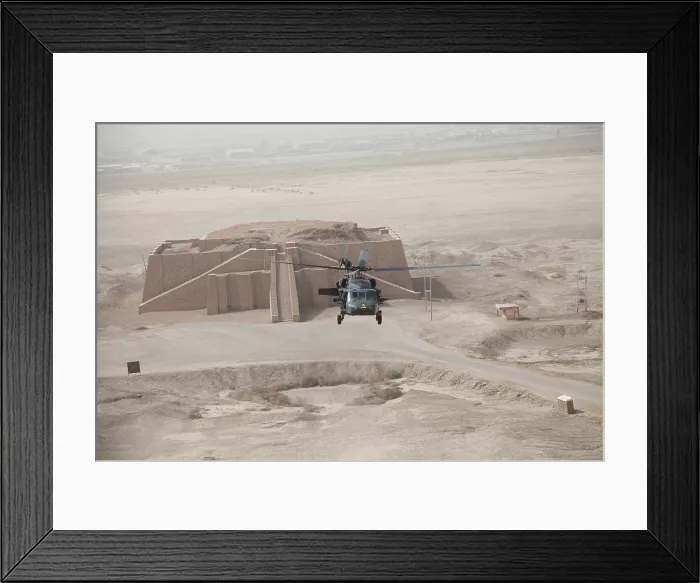 Framed Print : A US Army Black Hawk helicopter hovers above the ancient Ziggurat of Ur near Nasiriyah Iraq Oct. 11 2009. Aerial view shows the upper steps of the ancient Neo-Babylonian monument