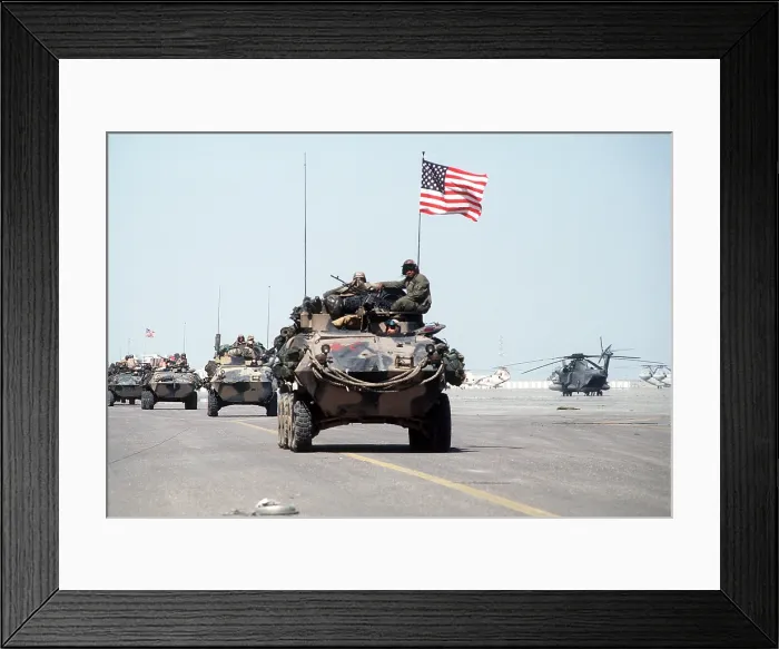 Framed Print : US Marines roll into Kuwait International Airport in light armored vehicles after the retreat of Iraqi forces during Operation Desert Storm. Feb. 27 1991. (BSLOC_2011_12_5)
