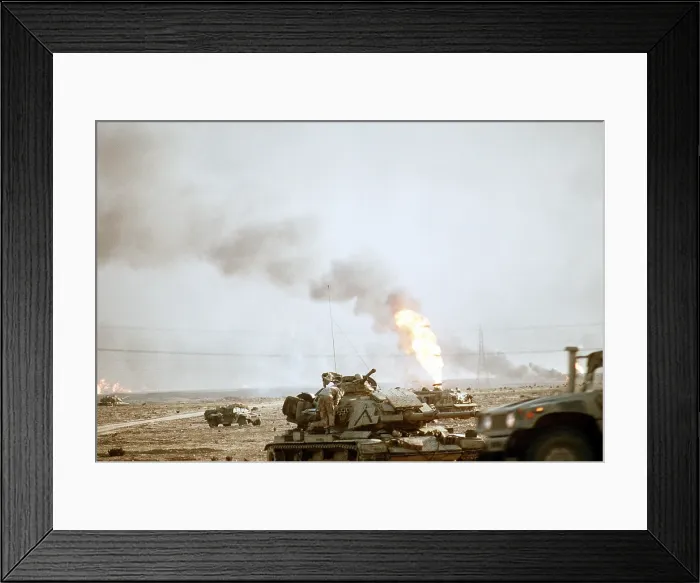 Framed Print : US Marine following the retreat of Iraqi forces from Kuwait as during Operation Desert Storm. Fires are from oil wells set ablaze by retreating Iraqi forces. Feb. 27 1991 Framed Print : US Marine following the retreat of Iraqi forces from Kuwait as during Operation Desert Storm. Fires are from oil wells set ablaze by retreating Iraqi forces. Feb. 27 1991