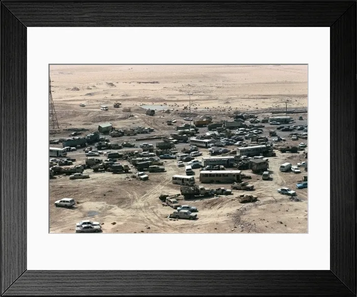 Framed Print : Iraqi Vehicles damaged and abandoned along Highway 80 west of Kuwait City during Operation Desert Storm. Mar. 1 1991. (BSLOC_2011_12_11)