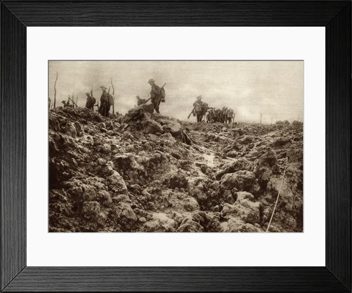 Framed Print : World War 1. Western front battleground has been churned up by shell explosions so that it bears no resemblance to its peacetime appearance. Allied soldiers are in the background Framed Print : World War 1. Western front battleground has been churned up by shell explosions so that it bears no resemblance to its peacetime appearance. Allied soldiers are in the background