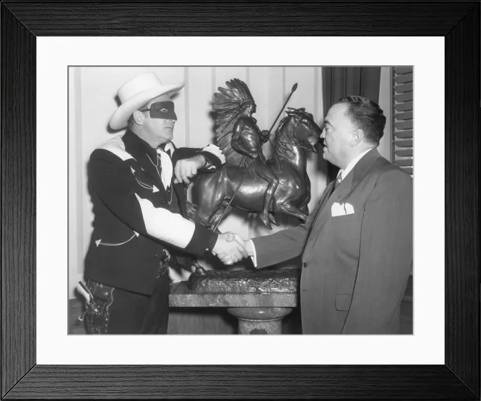 Framed Print : FBI Director J. Edgar Hoover with radio performer, Brace Beemer. Beemer was the voice of the Lone Ranger from 1941 to 1954, and made public appearances in costume Framed Print : FBI Director J. Edgar Hoover with radio performer, Brace Beemer. Beemer was the voice of the Lone Ranger from 1941 to 1954, and made public appearances in costume