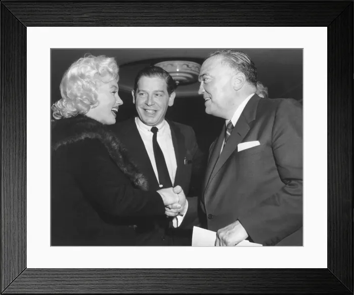 Framed Print : FBI Director J. Edgar Hoover shaking hands with Marilyn Monroe. With Milton Berle, they attended a Banshee Lunch, at the Waldoff Astoria, New York City