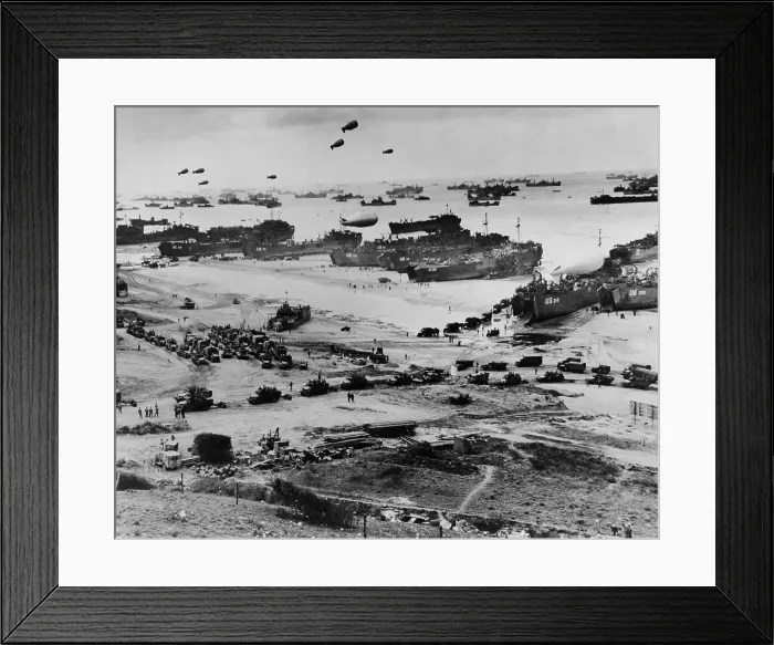 Framed Print : Omaha Beach after D-Day. Protected by barrage balloons, ships delivered trucks loaded with supplies. June 7-10, 1944, World War 2. Normandy, France, World War 2. (BSLOC_2014_2_50)