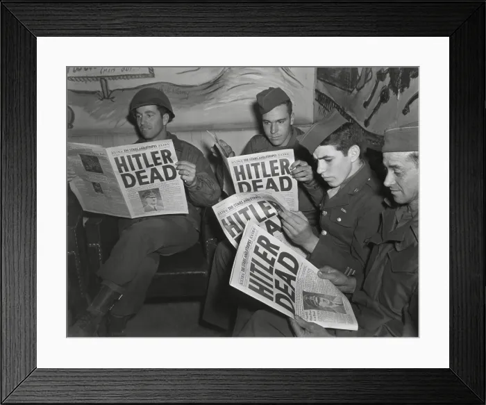 Framed Print : U.S. Soldiers read of Hitler's death in an Extra edition of Starts and Stripes, May 2, 1945