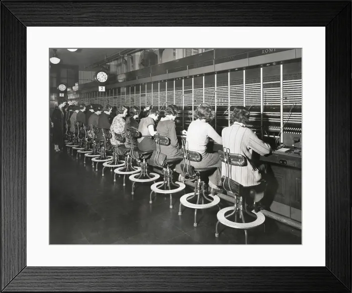 Framed Print : Telephone operators working on an international switchboard in the 1930s. - (BSLOC_2015_1_227) Framed Print : Telephone operators working on an international switchboard in the 1930s. - (BSLOC_2015_1_227)