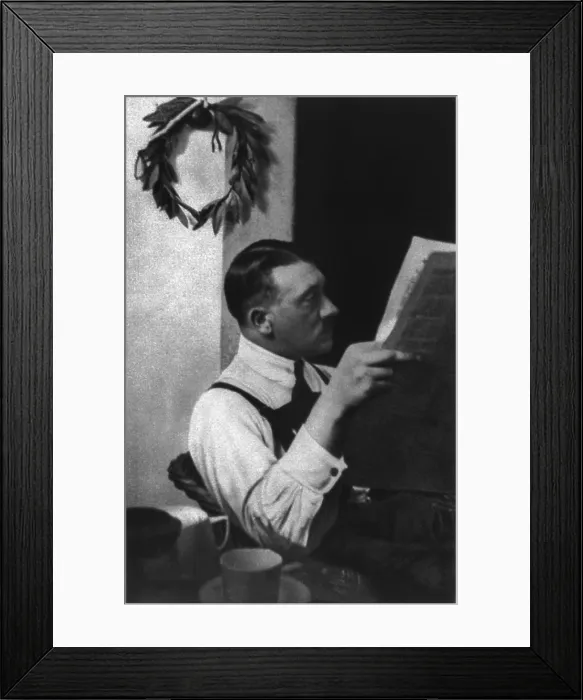 Framed Print : Adolf Hitler reading newspaper in Landsberg prison, 1924. He served nine months for his role in an attempted a coup d'tat in Munich, known as the Beer Hall Putsch in 1923