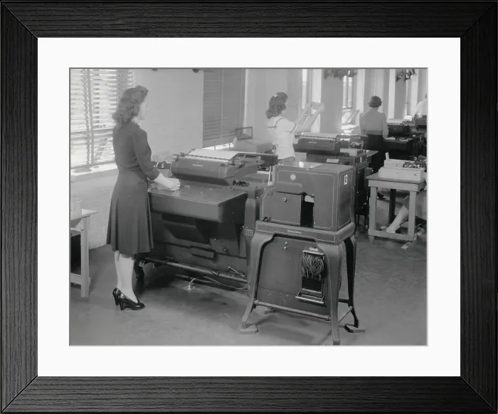 Framed Print : A woman operates one of 12 IBM computers in use during the 1940 Census