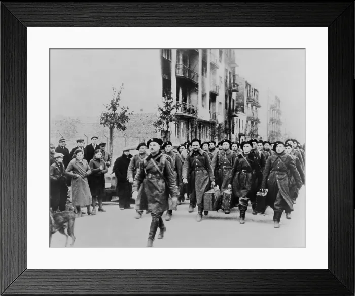 Framed Print : Defeated Polish soldiers march out of Warsaw to a prison camp after defeat by German invaders. Polish civilians watch the sad parade. World War 2, ca. Sept-Oct. 1940