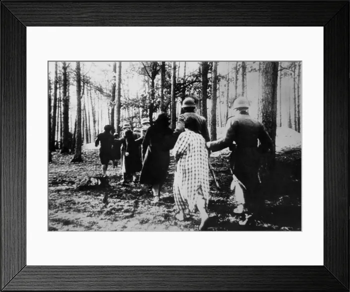 Framed Print : German atrocities in Poland ca. 1941. Polish women led by soldiers through woods to their execution during World War 2. (BSLOC_2013_11_37)
