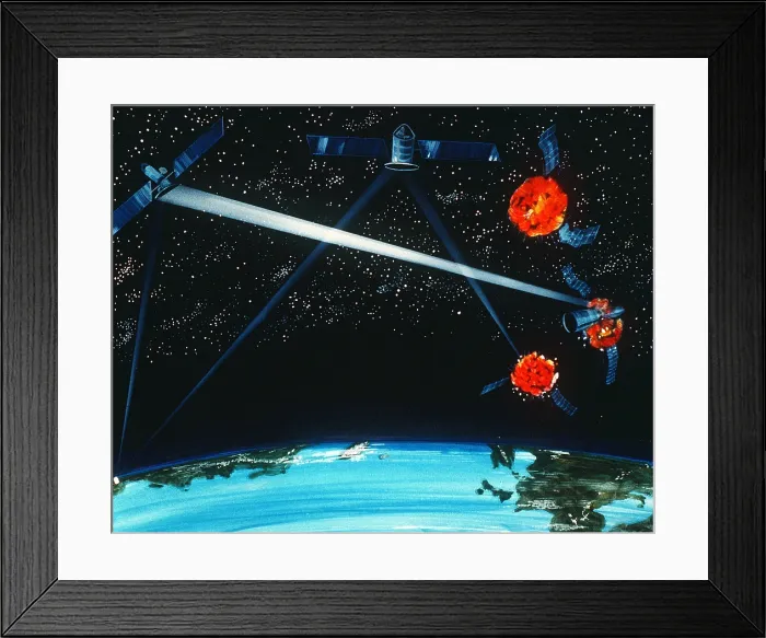 Framed Print : 1984 military artist's concept of a hybrid ground and space-based laser weapon destroying enemy satellites. (BSLOC_2011_12_346)
