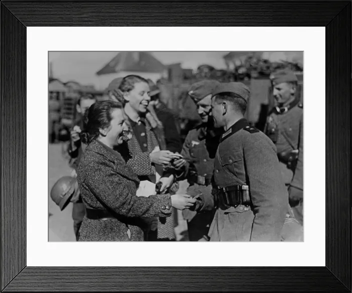 Framed Print : Soldiers receive gifts from Austrian women after the Anschluss, 1938. (BSLOC_2013_9_187) Framed Print : Soldiers receive gifts from Austrian women after the Anschluss, 1938. (BSLOC_2013_9_187)