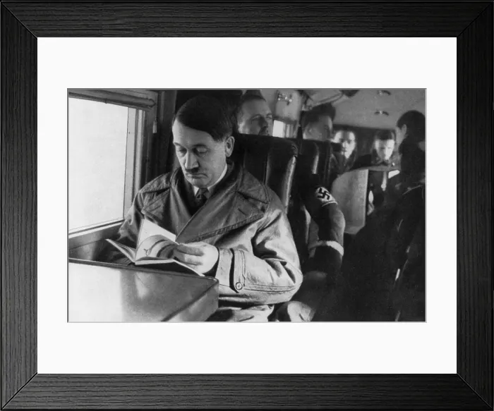 Framed Print : Adolf Hitler reading in airplane, ca. 1940. (BSLOC_2013_9_167) Framed Print : Adolf Hitler reading in airplane, ca. 1940. (BSLOC_2013_9_167)