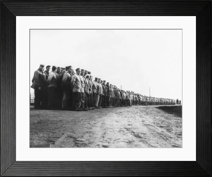 Framed Print : German political prisoners at a labor camp in 1935. Hundreds of prisoners stand in long rows, at a concentration camp in the Emsland region of Germany. Photo by Walter Talbot