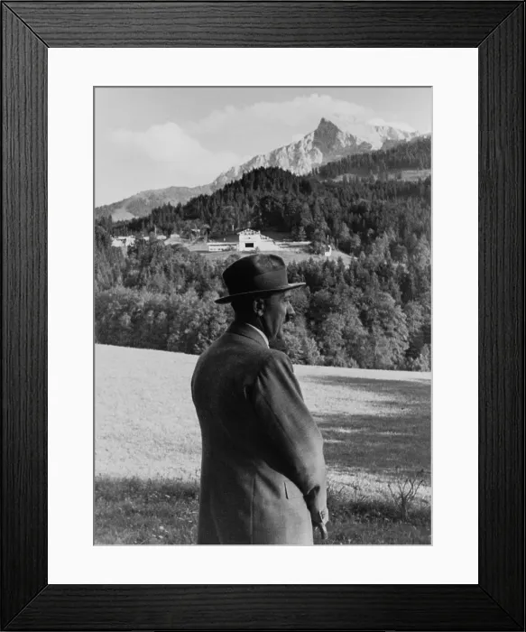 Framed Print : Adolf Hitler looking over his estate, in Berchtesgaden, German. His country house under construction, on the Obersalzberg in the background. Ca. 1935. (BSLOC_2013_9_165)