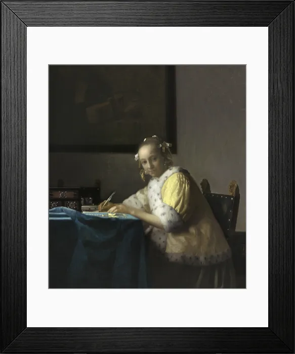 Framed Print : A Lady Writing, by Johannes Vermeer, c. 1665, Dutch painting, oil on canvas. Soft light illuminates the tabletop and, the woman's face