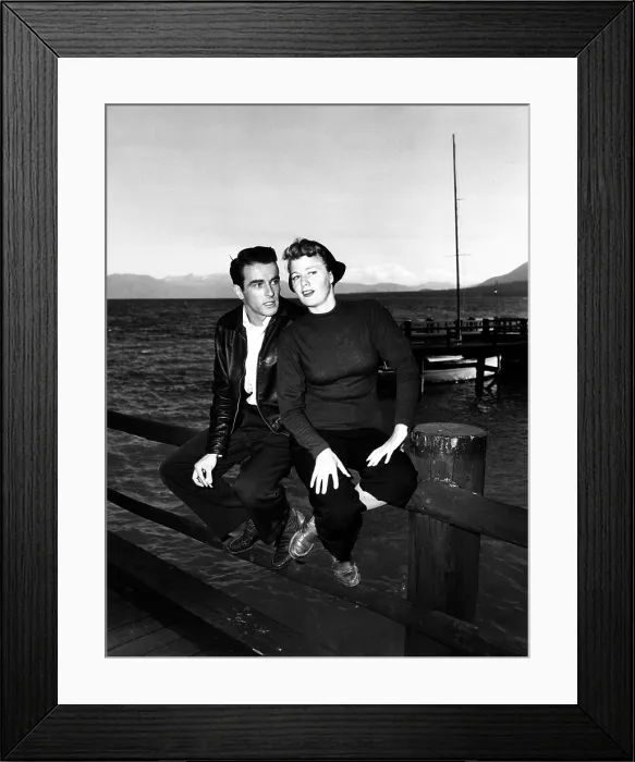 Framed Print : A PLACE IN THE SUN, from left, Montgomery Clift, Shelley Winters, between scenes on location, 1951
