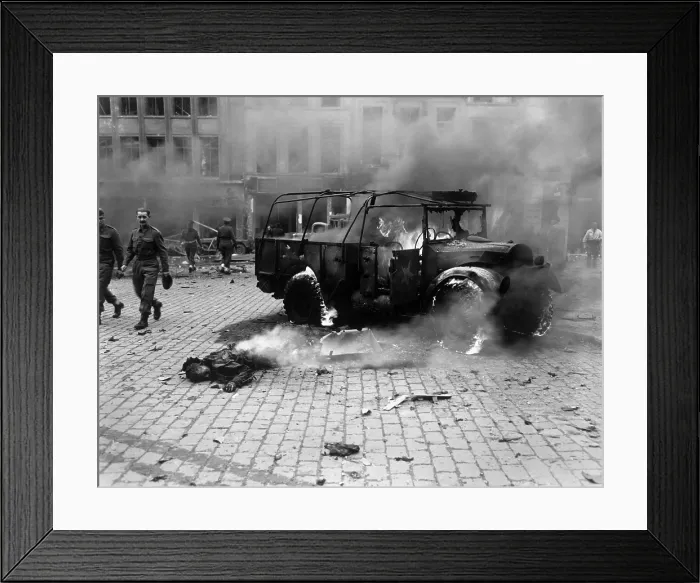 Framed Print : This boy's dead body and burning U.S. Jeep after a V-2 Strike in Antwerp, Belgium, Nov. 27, 1944