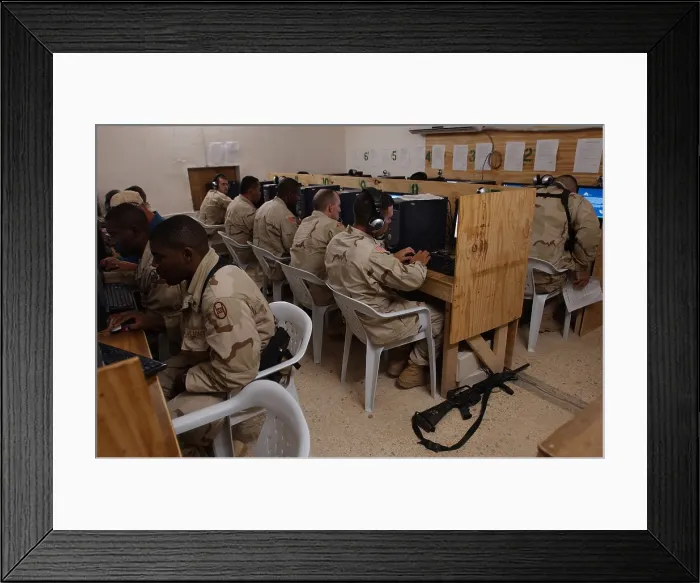 Framed Print : US Army soldiers e-mail their families before eating Thanksgiving dinner at Camp Cobra in Iraq on Nov. 25 2004. (BSLOC_2011_12_283)