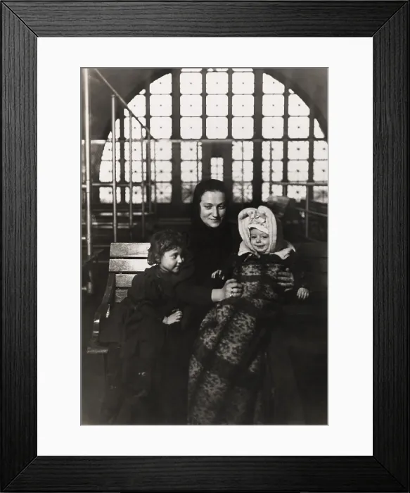 Framed Print : European immigrant mother with two young children at Ellis Island, c. 1908
