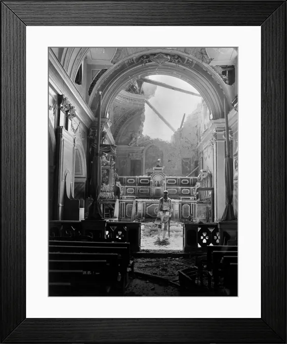 Framed Print : Private Paul Oglesby, stands before the altar of a damaged Catholic Church during World War 2