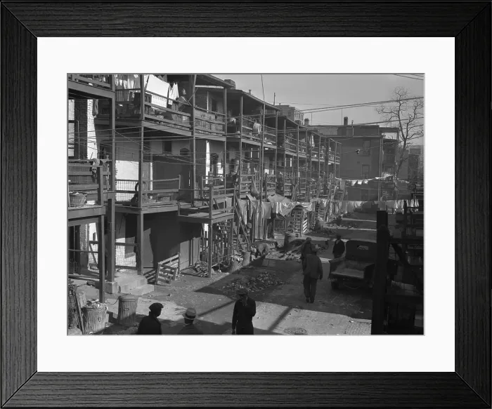 Framed Print : Depression era slums in Washington D.C. African American men in the backyards of three story row houses. Nov. 1935 Framed Print : Depression era slums in Washington D.C. African American men in the backyards of three story row houses. Nov. 1935