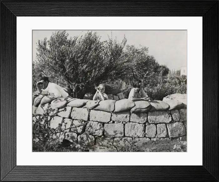 Framed Print : Jews guard their settlement in Palestine. A man and two children watch for trouble from behind stone wall of a Jewish colony. Sept. 15, 1937. (BSLOC_2013_9_205)