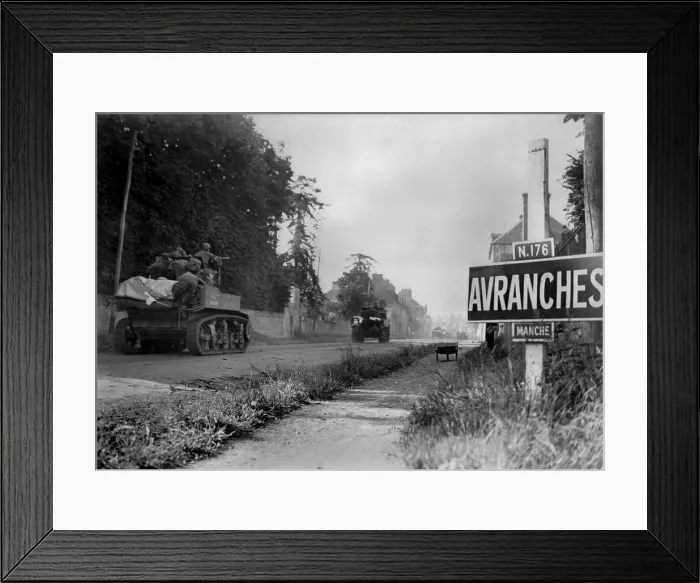 Framed Print : U.S. light tanks passing a road sign for the town of Avranches, southeast of the Falaise Pocket. In the early days of Operation Cobra, the First U.S