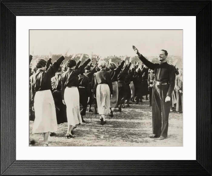 Framed Print : Sir Oswald Mosley at Black Shirt Rally, London, Sept. 14, 1934. As leader of the British Union of Fascists, he takes salute from women party members in Hyde Park Framed Print : Sir Oswald Mosley at Black Shirt Rally, London, Sept. 14, 1934. As leader of the British Union of Fascists, he takes salute from women party members in Hyde Park