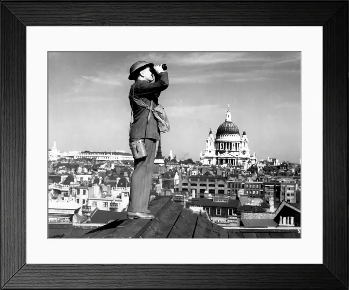 Framed Print : Aircraft spotter searches the sky with binoculars during the Battle of Britain. St. Paul's Cathedral is in the background. World War 2, ca. 1940-41. (BSLOC_2013_11_80) Framed Print : Aircraft spotter searches the sky with binoculars during the Battle of Britain. St. Paul's Cathedral is in the background. World War 2, ca. 1940-41. (BSLOC_2013_11_80)