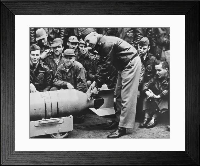 Framed Print : Lt. Col. Jimmy Doolittle, wires a Japanese medal to the fin of a 500 lb. bomb. On April 8, 1942, it was returned to its Japanese makers Framed Print : Lt. Col. Jimmy Doolittle, wires a Japanese medal to the fin of a 500 lb. bomb. On April 8, 1942, it was returned to its Japanese makers