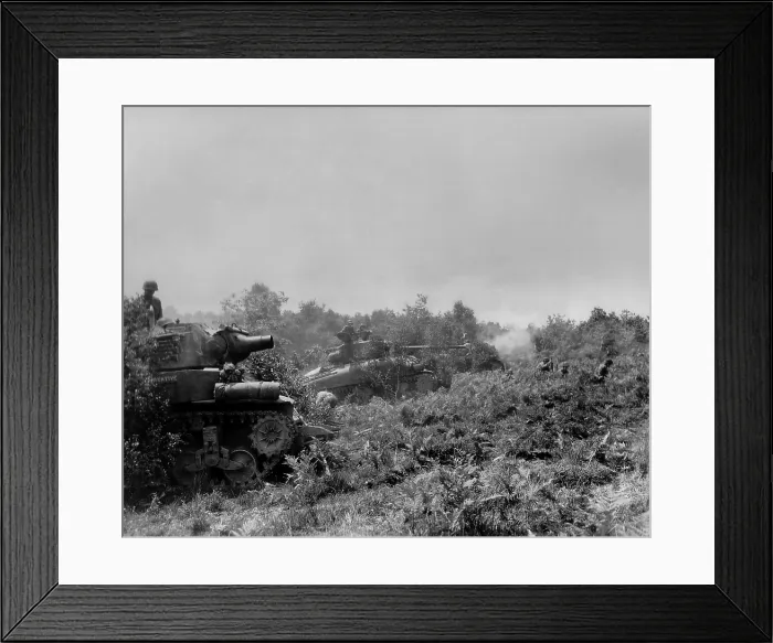 Framed Print : Three U.S tanks firing on German positions in the Battle of the Falaise Pocket. Three soldiers are on the ground in front of the tanks Framed Print : Three U.S tanks firing on German positions in the Battle of the Falaise Pocket. Three soldiers are on the ground in front of the tanks