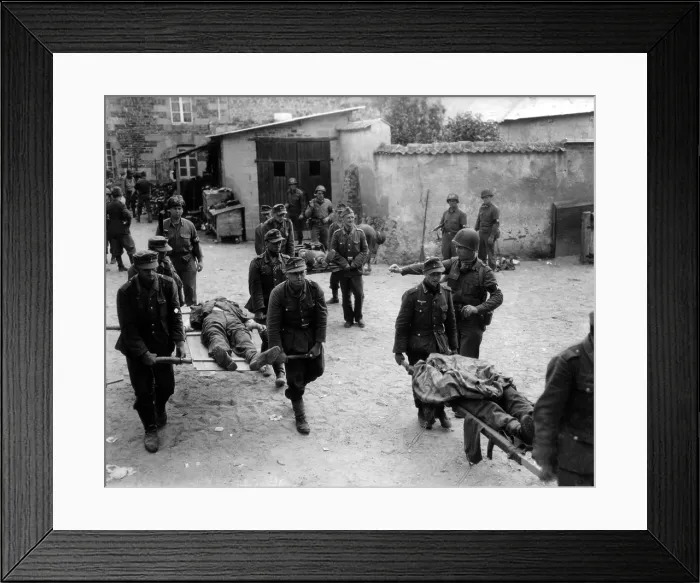 Framed Print : German prisoners carry their fallen comrades for burial at Brehal, France. Guarded by U.S. Military Police, the POW's were captured during the U.S. offensive, Operation Cobra Framed Print : German prisoners carry their fallen comrades for burial at Brehal, France. Guarded by U.S. Military Police, the POW's were captured during the U.S. offensive, Operation Cobra