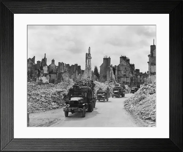 Framed Print : Trucks, some with U.S. soldiers standing in back, riding through the ruins Valognes, France. June-July 1944. Normandy Campaign, World War 2. (BSLOC_2014_2_129) Framed Print : Trucks, some with U.S. soldiers standing in back, riding through the ruins Valognes, France. June-July 1944. Normandy Campaign, World War 2. (BSLOC_2014_2_129)