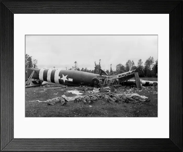 Framed Print : Eight dead U.S. paratroopers lie beside their destroyed Horsa glider in a Normandy pasture Framed Print : Eight dead U.S. paratroopers lie beside their destroyed Horsa glider in a Normandy pasture