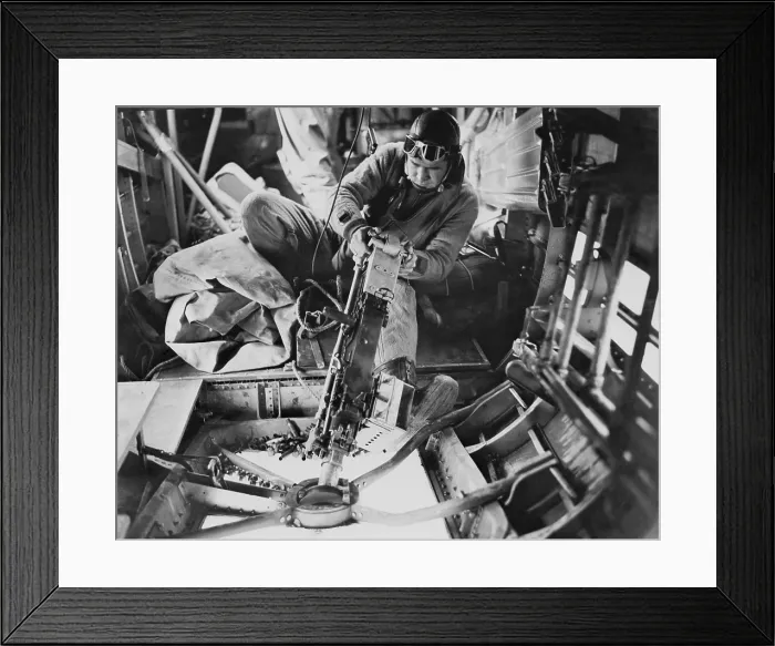 Framed Print : U.S. Army Air Force gunner operating a machine gun during a aerial fight with German planes. World War 2. Ca. 1942-43. (BSLOC_2014_6_33)