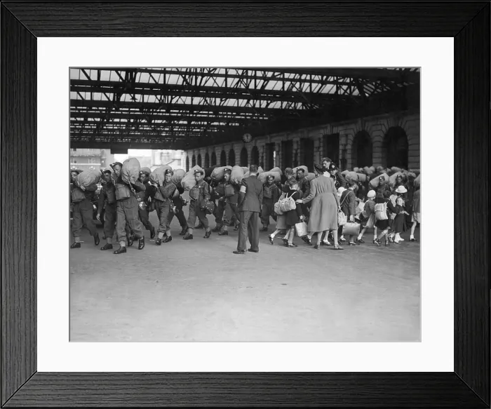 Framed Print : World War 2, Battle of Britain. Going in opposite directions, troops arrive in a London railroad station, as children are evacuated to the safer countryside. Ca. 1940 Framed Print : World War 2, Battle of Britain. Going in opposite directions, troops arrive in a London railroad station, as children are evacuated to the safer countryside. Ca. 1940
