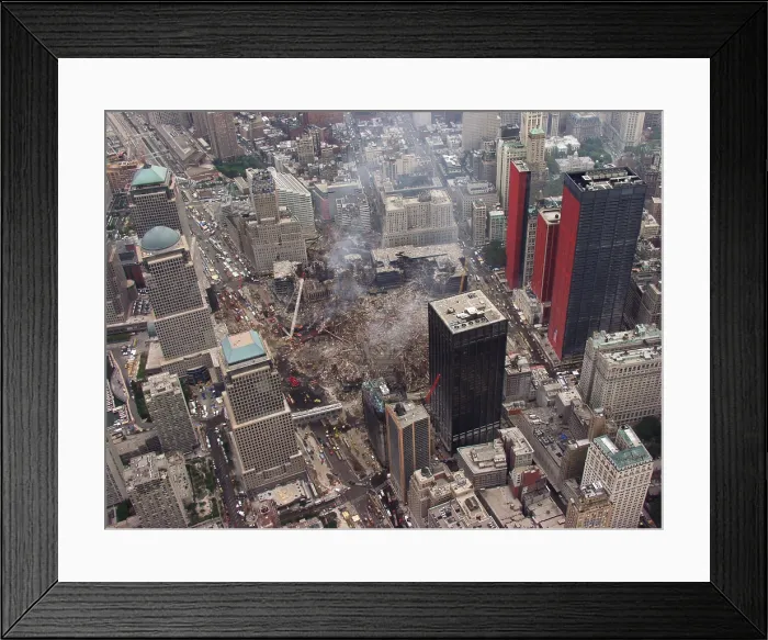 Framed Print : Aerial view of World Trade Center from the southwest, Sept. 27, 2001. Orange reinforcing plastic covers the street facades of severely damaged buildings on Church Street Framed Print : Aerial view of World Trade Center from the southwest, Sept. 27, 2001. Orange reinforcing plastic covers the street facades of severely damaged buildings on Church Street