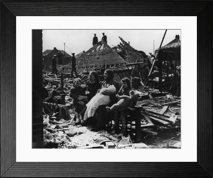 Framed Print : Battle of Britain, World War 2. British family seated outside their bombed home and neighborhood. Ca. 1940-41. (BSLOC_2013_11_94) Framed Print : Battle of Britain, World War 2. British family seated outside their bombed home and neighborhood. Ca. 1940-41. (BSLOC_2013_11_94)