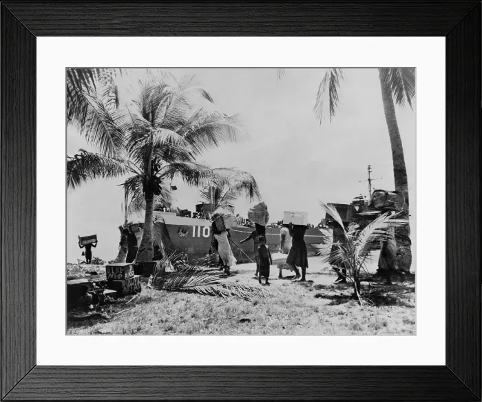 Framed Print : People of Bikini Atoll carry their belongings down to boat. 40 families were temporarily moved to Rongerik Atoll on March 7, 1946